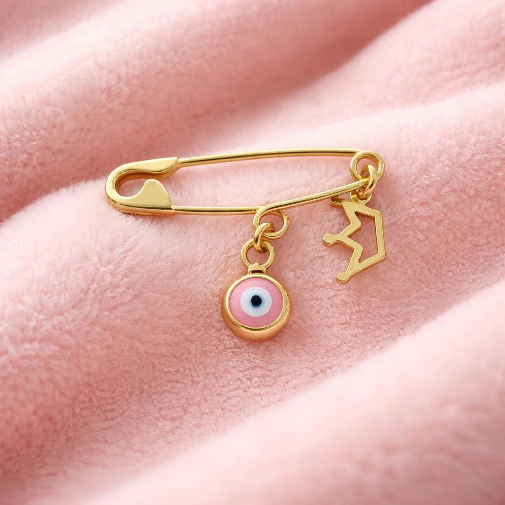 Gold Evil Eye Baby Safety Christening Pin Brooch with Crown Charm on a smooth pink baby  blanket - 24jewels