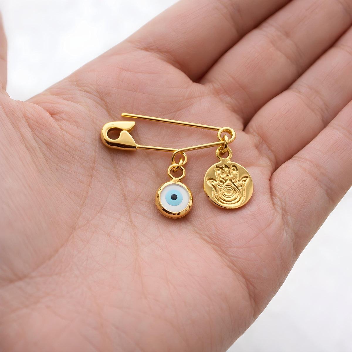 Sterling Silver Safety Pin Evil Eye Brooch With Hamsa Charm in a palm : Protection Baby Jewellery - 24jewels