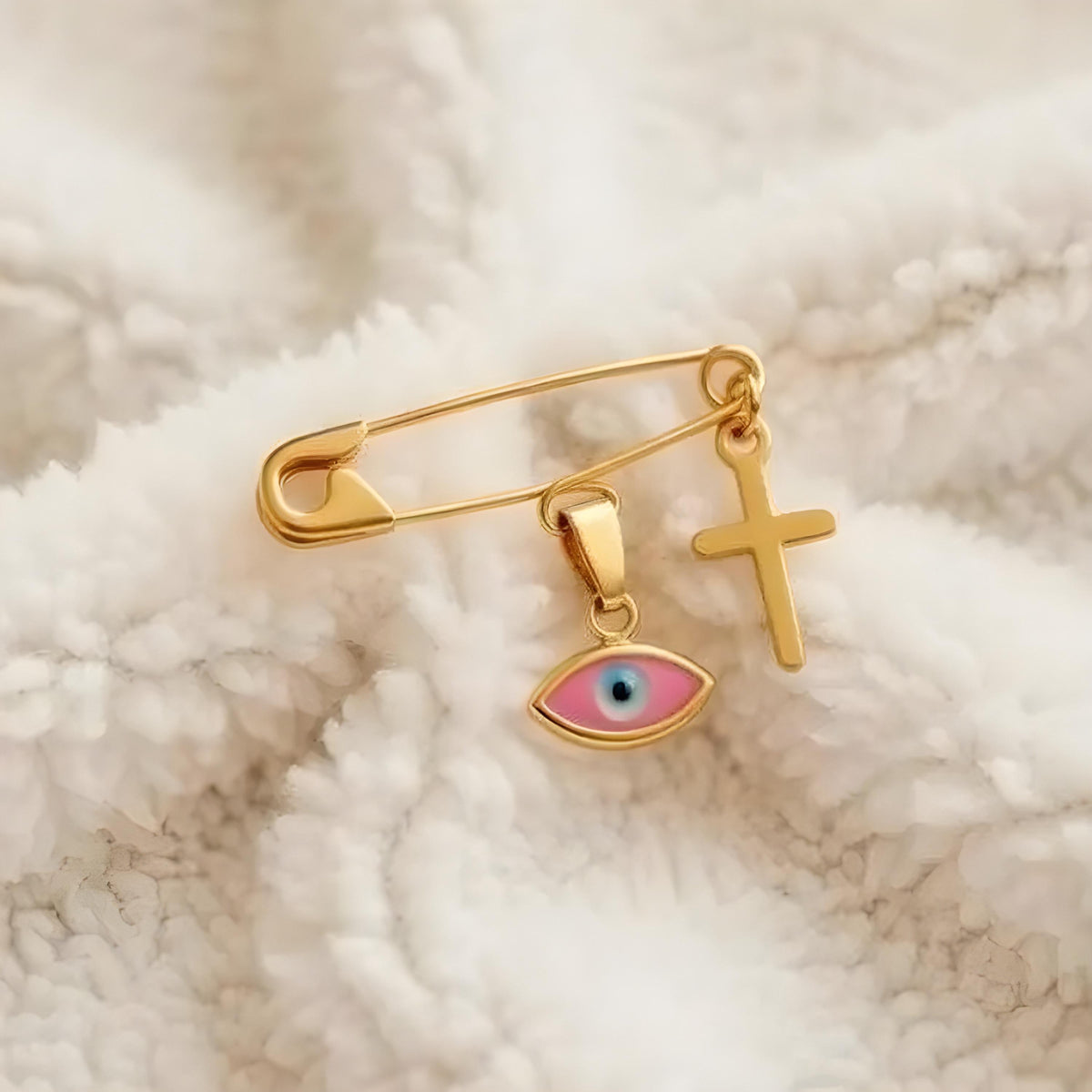 Gold Safety Pin Brooch with Evil Eye & Cross On A Smooth Blanket | Baptism Gift - 24jewels