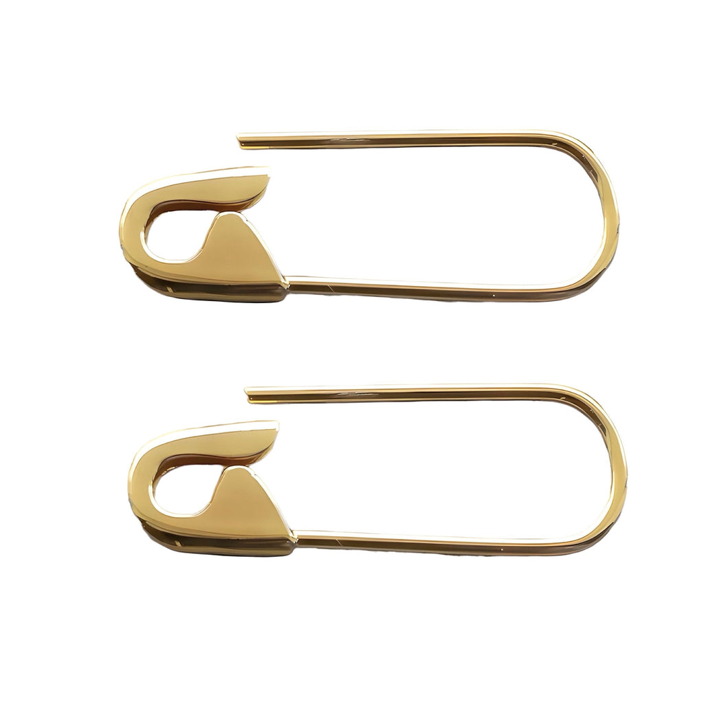 Pair of yellow gold safety pin hoop earrings with smooth finish and minimalist design on white background .