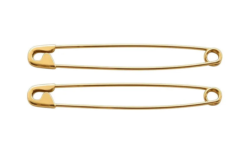 Pair of sleek 14K yellow gold long safety pin earrings measuring 1.75 inches on white background .
