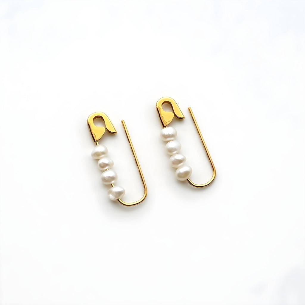 Gold safety pin hoop earrings with four white freshwater pearls each, edgy modern design .