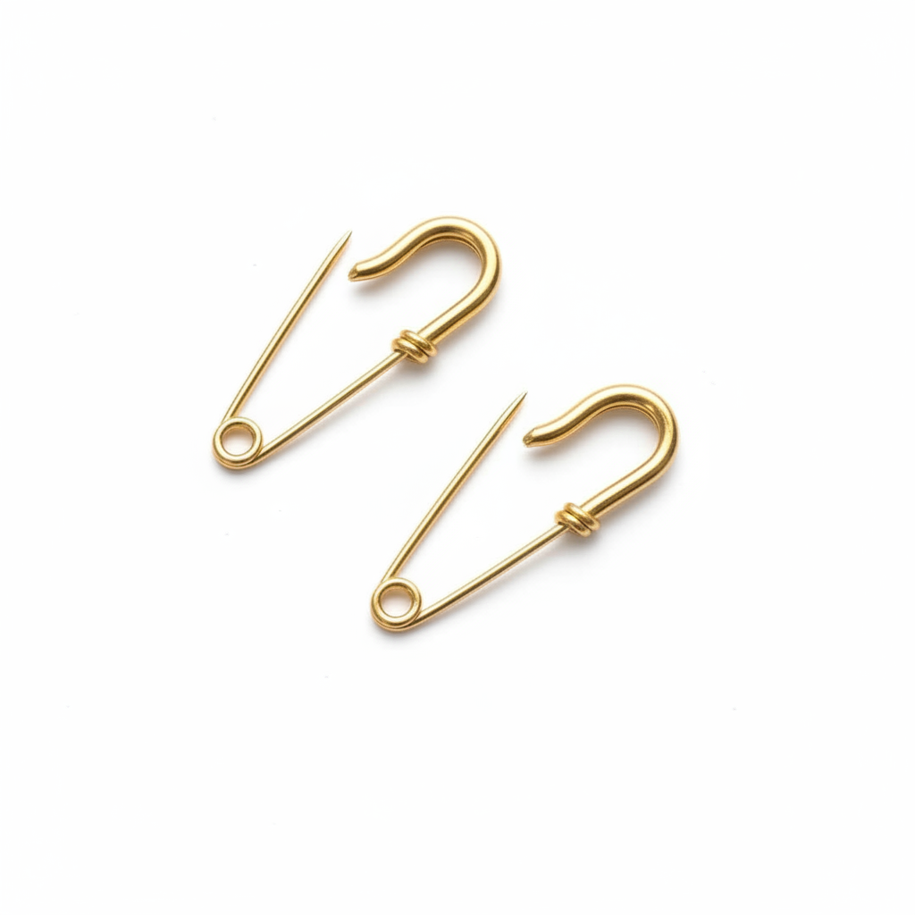 Small gold plated wire silver safety pin earrings with minimal industrial design 