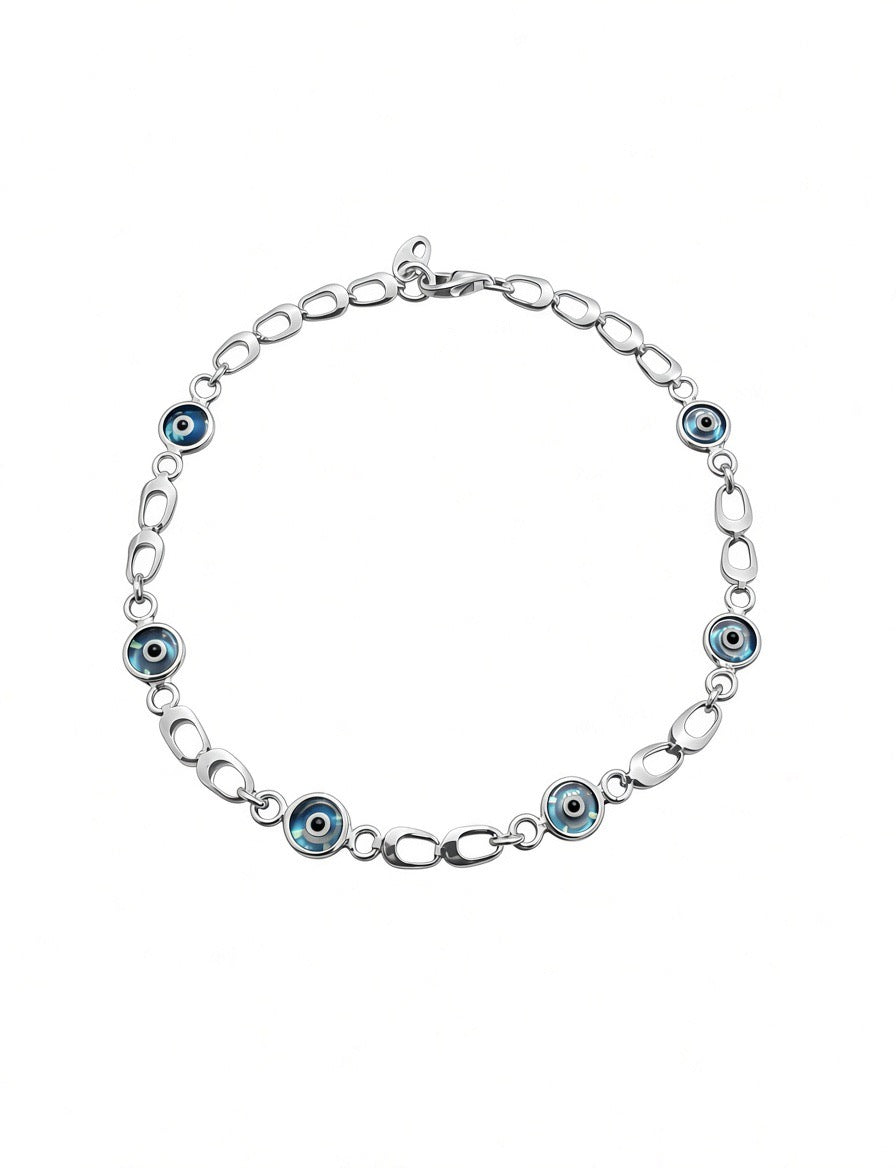 Dainty sterling silver chain bracelet with six blue and white evil eye charms, gold plated accents.