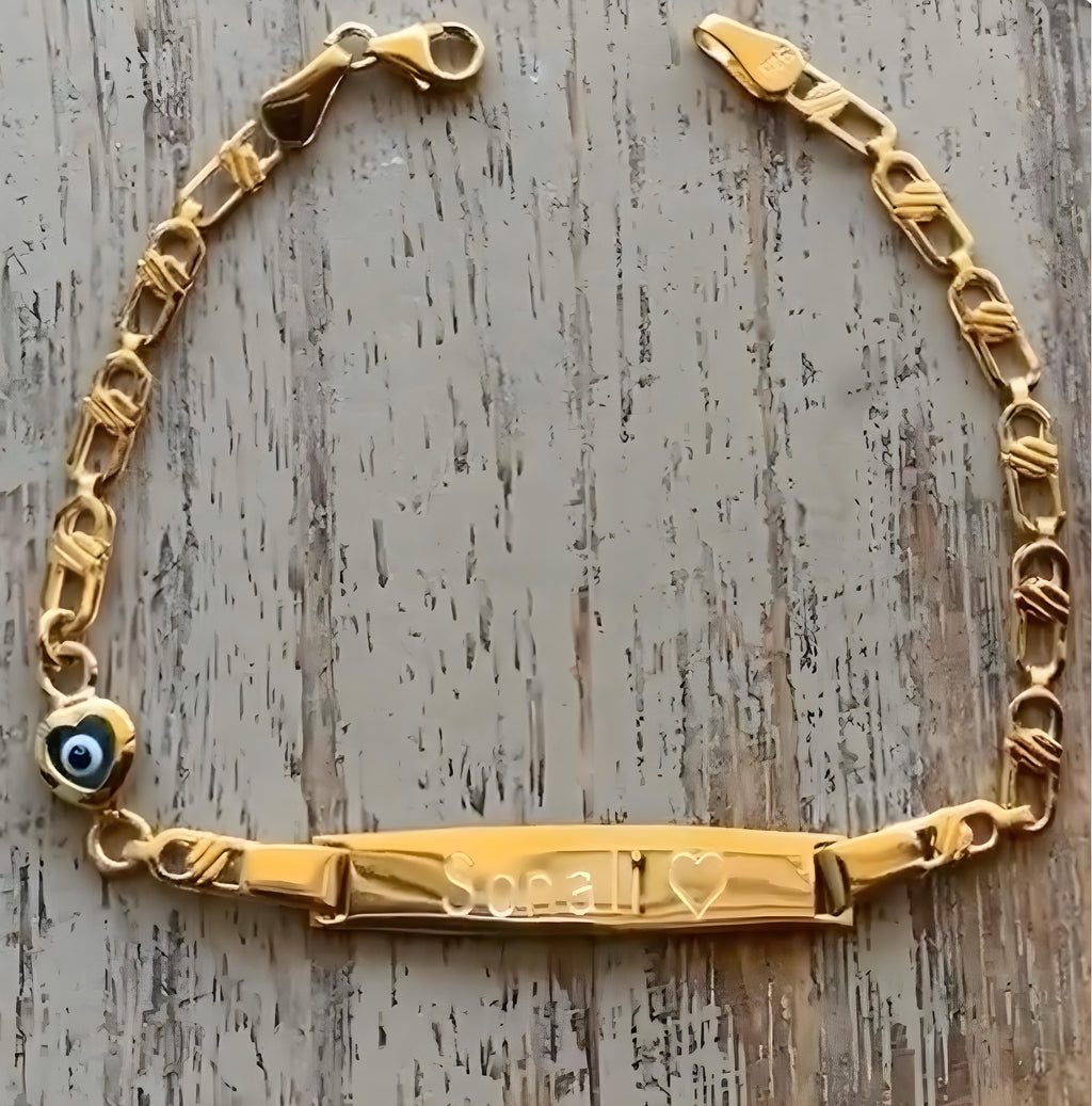 Personalized sterling silver baby bracelet gold plated with heart evil eye on wooden surface - 24jewels