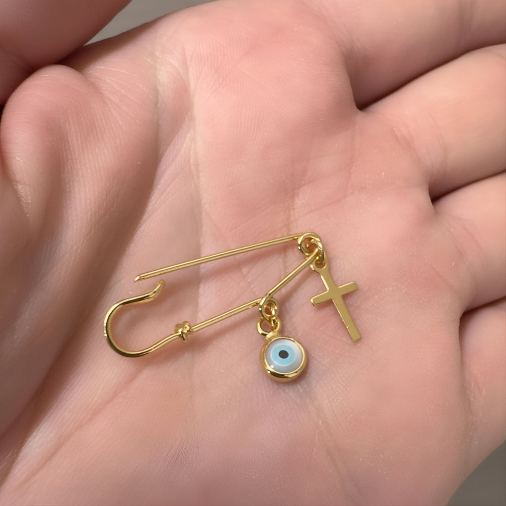 Sterling Silver Evil Eye Safety Pin Baby Brooch With Cross Gold Plated  held in an open palm - 24jewels