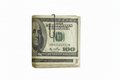 sterling silver paperclip moneyclip holding some 100 dollar bills