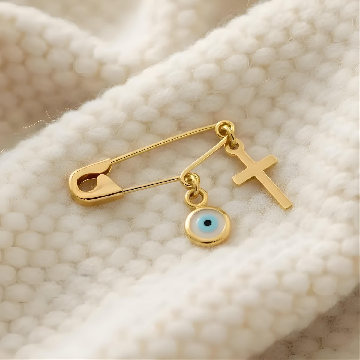 Sterling Silver Safety Pin Evil Eye Brooch Gold Plated on a white soft blanket :Religious Baby Jewellery - 24jewels