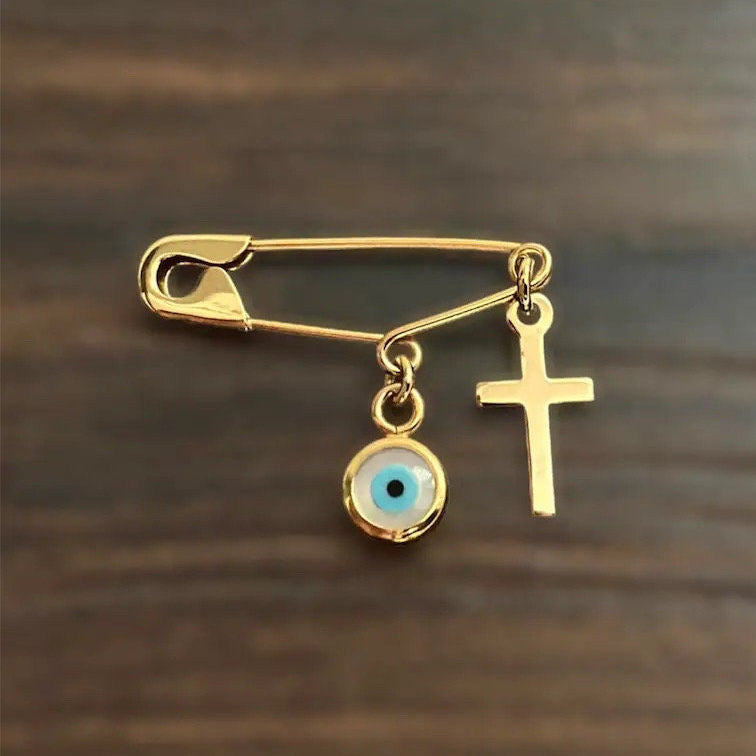 Sterling Silver Safety Pin Evil Eye Brooch Gold Plated on wooden surface :Religious Baby Jewellery - 24jewels