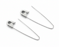 Sterling silver safety pin hoop earrings with 1.25-inch thin wire and sleek polished finish on white background .