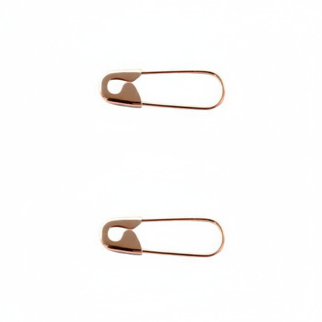 Sterling silver 3/4" hoop rose gold plated earrings shaped like safety pins with polished finish on white background .