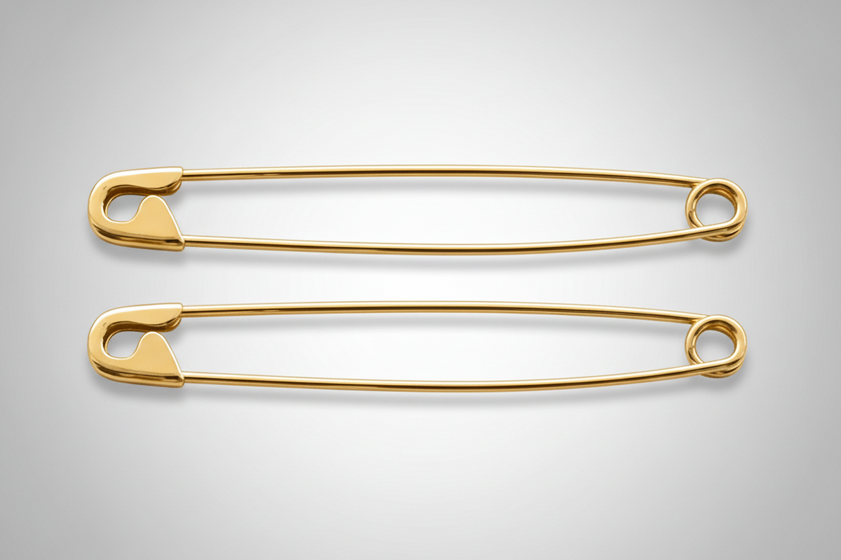 Pair of long gold-plated safety pin earrings measuring 1.75 inches on gray background.