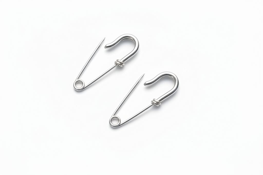 Small wire silver safety pin earrings with minimal industrial design 