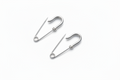 Small wire silver safety pin earrings with minimal industrial design 