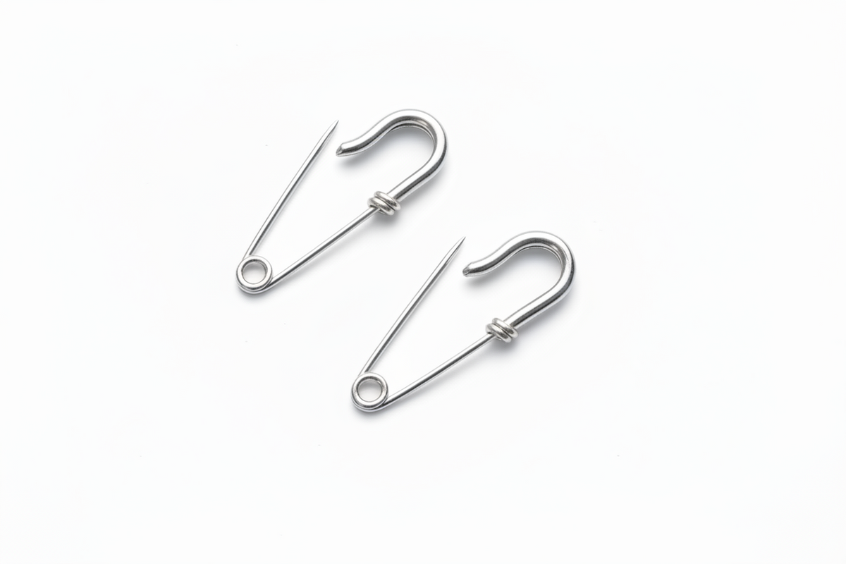 Small wire silver safety pin earrings with minimal industrial design 