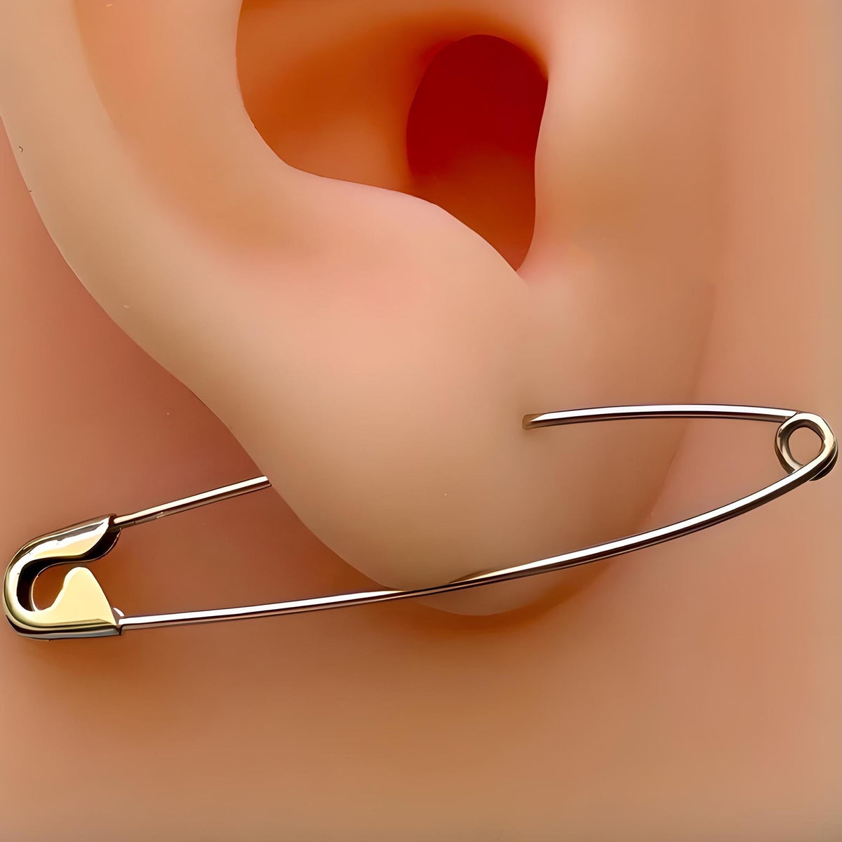 white gold long safety pin earring on ear, edgy minimalist dangle style 1.75 inches .