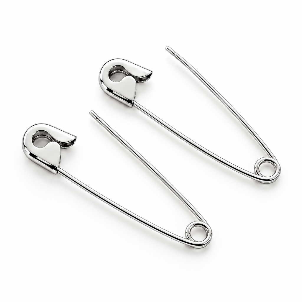 Pair of slim white gold safety pin earrings with a polished finish on white background.