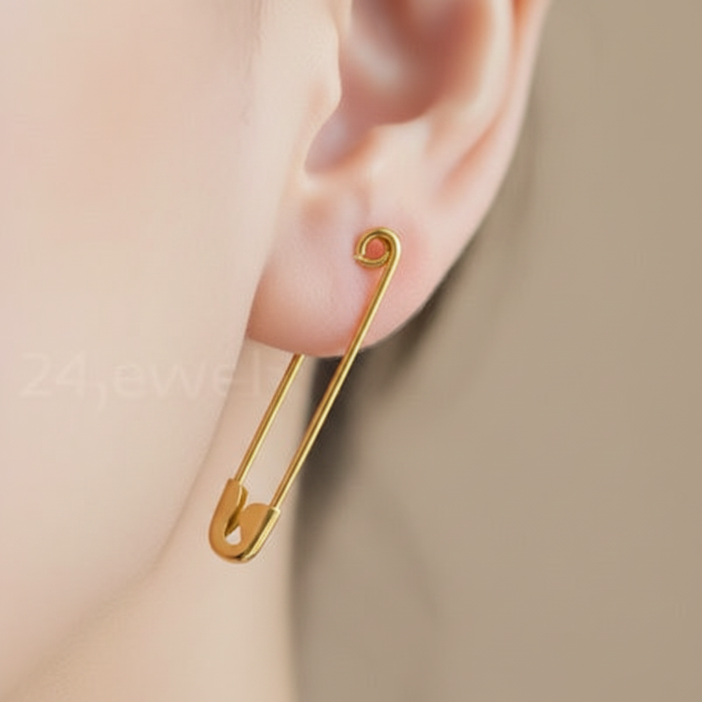 Gold safety pin silver earring 1.25 inches long, minimalist and sleek design on ear.