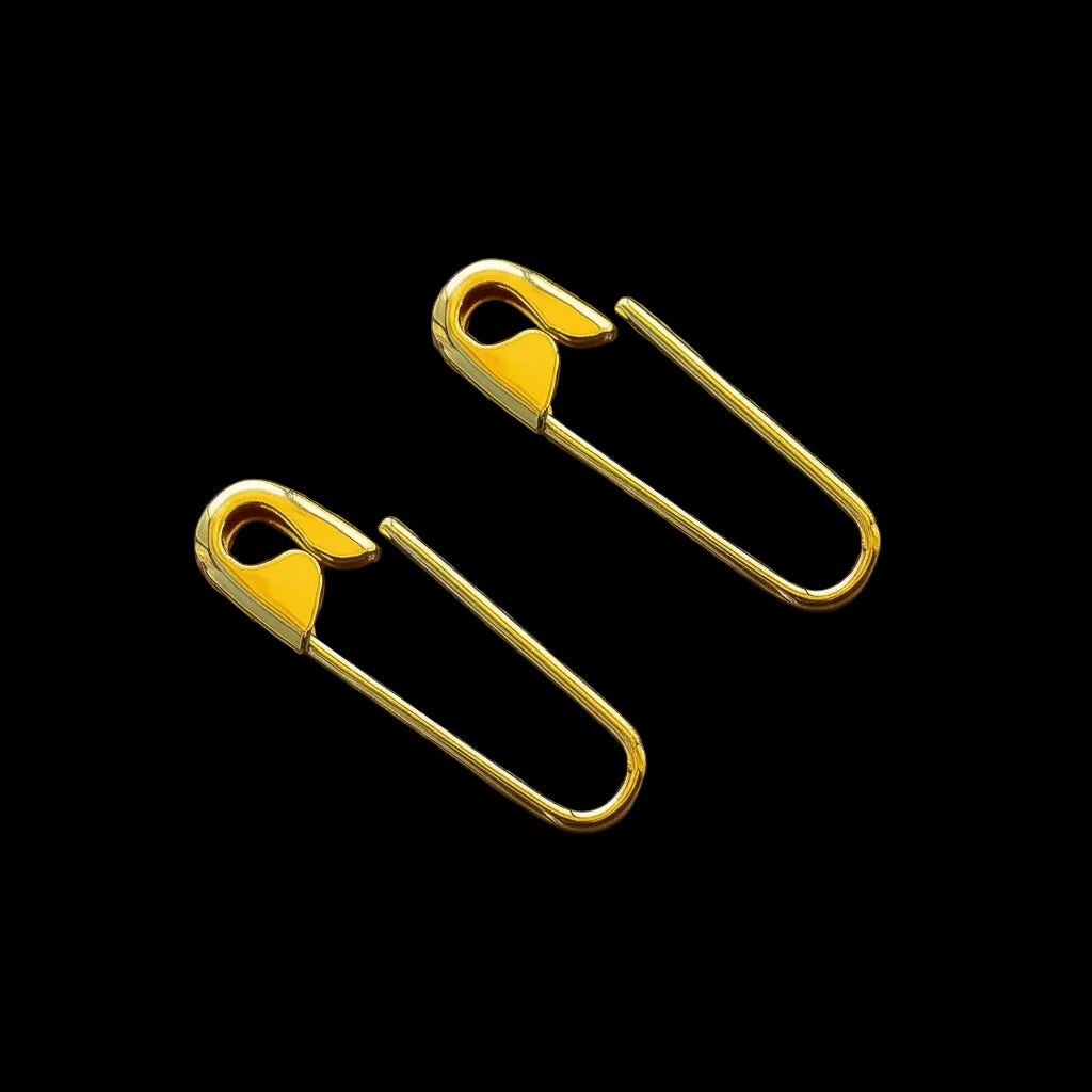 Gold-tone safety pin style hoop earrings with a minimalist 3/4” design and smooth finish.